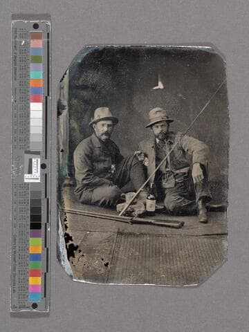 Two portraits of men posed with studio props