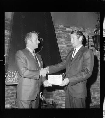 Men receiving Certificates of Completion for Distribution Technology School