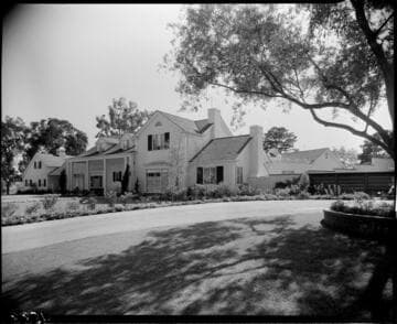 Large mansion surrounded by trees