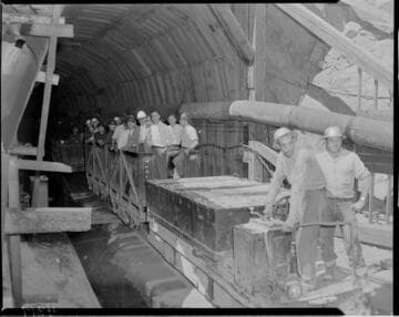 Big Creek tour group riding rail cars through the  Big Creek Powerhouse #4 power tunnel