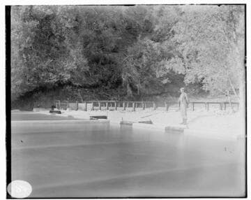 A person standing by the sandbox at Mill Creek #3 Hydro Plant
