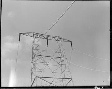 Pulling conductor through tower crossarm