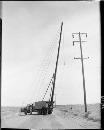stringing wire on transmission pole