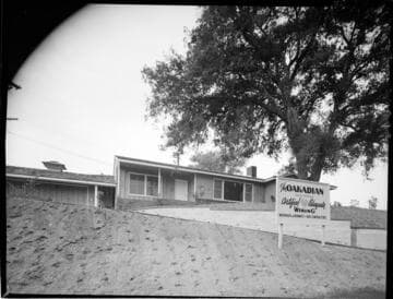 New home exterior with sign for "Certified Adequate Wiring"