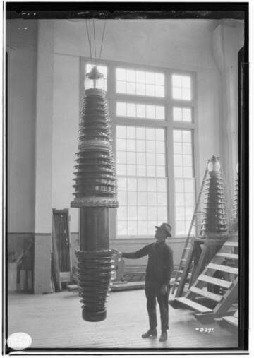 220kV Bushings from factory to service at Big Creek.  Man standing by new bushing