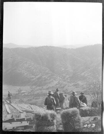 A construction crew gathered at the top of the tram at the construction site of Tule Plant