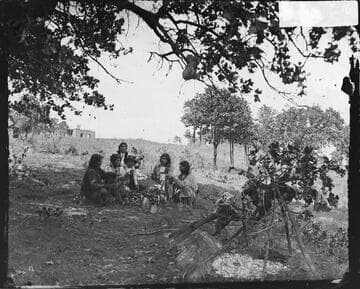 Camp scene with Black Bear, Dangerous Eagle, and others (Comanche). Indian Territory, 1874