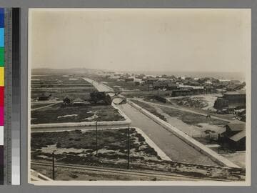 View from "Race Thru the Clouds" roller coaster of Venice canals and homes