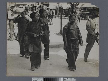 Four Chinese women in traditional clothing crossing a street in Old Chinatown, Los Angeles