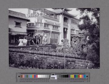 People at the Seven Star Sacred Caverns and wishing well and pool