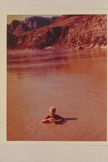Gordon Avil fills canteen from the Silvery Colorado.  Camp above Mile 217 Rapid