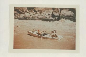 Nevills pulls down the eddy below Vulcan Rapid after lining the sadirons.  Nevills strains at the oars while Joe Desloge and Margaret Marston watch from the stern