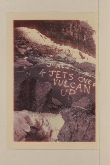 Sign painted on the rocks at the edge of Vulcan Rapid after the four jet boats topped it 1960, July 06. Dupe slide made by a member of the White party