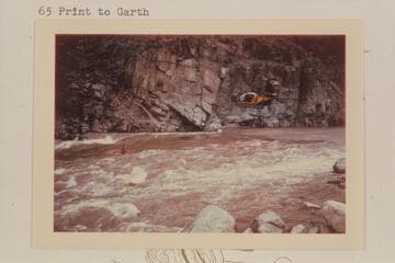 Motion picture camera in chopper follows Garth Marston; 217 Mile Rapid.  Wilding camera crew.  Sportyak
