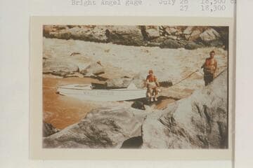 Lining the Nevills sadirons at Vulcan Rapid.  Nevills perches on the bow.  Joe Desloge handles the painter