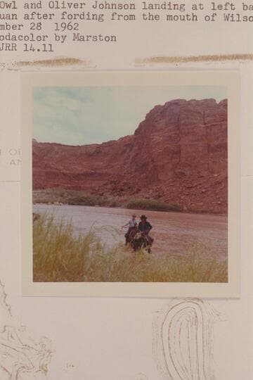 Toby Owl and Oliver Johnson landing at left bank of the San Juan after fording from the mouth of Wilson Creek