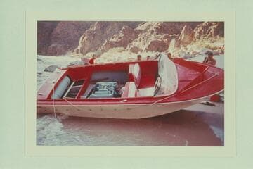 The battered "WEE RED" on the beach at Monument Creek Rapid