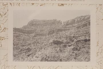 Tower of Ra from upper Redwall summit block looking southwest from point above Redwall climb.  The openings in the Redwall on Ra are shallow shelters