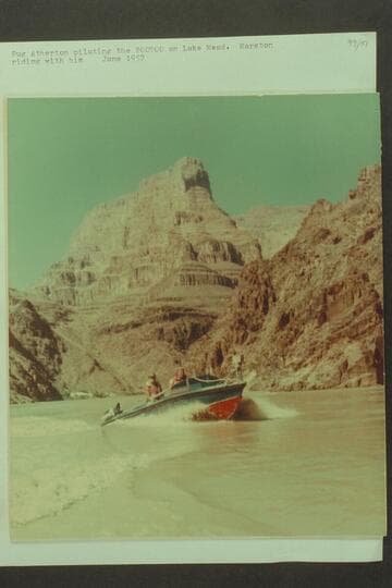 Pug Atherton piloting the "Bootoo" on Lake Mead.  Marston riding with him