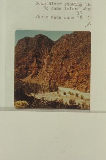 Down river showing the lower end of Disaster Falls and No Name Island where the Powell boat cracked up on June 8, 1869