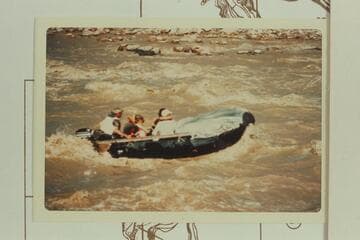 George Stewart's 10-man, powered with 6 HP Merc, and with John at the controls, is off-course about 10 ft. to the right in entering Coal Creek Rapid, and the craft drove into a hole half filling with water