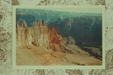 Air photo of Meriwitica Canyon showing spring at lower right and cave at middle of wall at left.  Grand Canyon is in the background