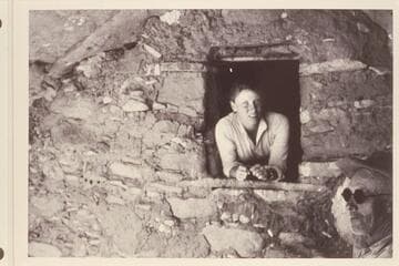 Sarah Fraser in granary.  Dave Rust in the shadow at right.  The granary is near the Stone-Stanton dredge at Mile 121, Glen Canyon