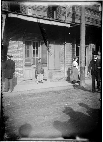 Boy standing in front of building on Ferguson Alley