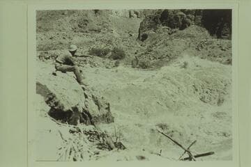 Guy Forcier studying the head of Lava Falls and betting that it wouldn't be run successfully