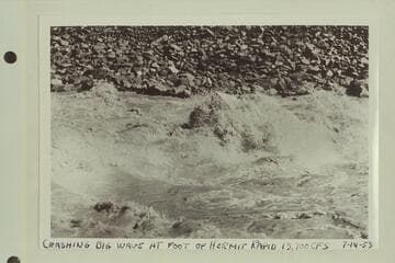 P. T. Reilly in a Reynolds sadiron riding the big wave at the foot of Hermit Rapid
