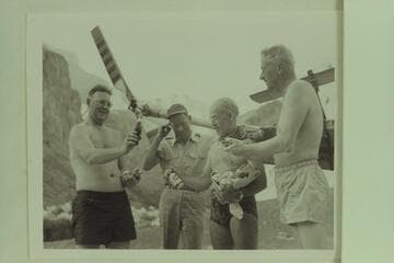 Red Carson arrived at Hance Rapids by helicopter bringing some light refreshment.  Left to right:  Ed Hudson, Carson, Marston and Desloge