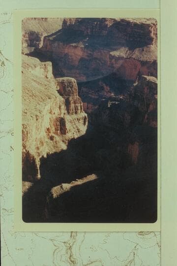 Down Fern Glen Canyon to its mouth showing Alamo Window at left