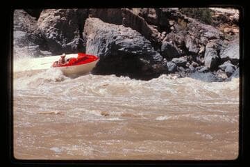 "Wee Red" climbing Vulcan Rapids