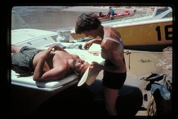 Joyce works over Jim's beard; camp above Unkar Rapids