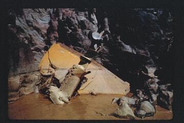 Transom and motor from Harris-Brennan boat in rocks at Mile 77