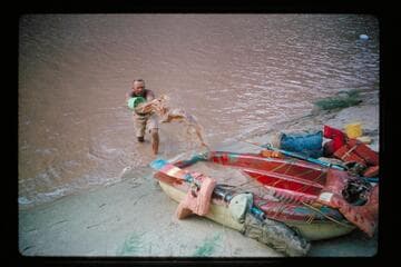 Belknap fills a boat to settle water; Diamond Creek