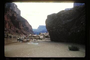 Up river at camp at overhanging which capsized; Hansbrough and Richards