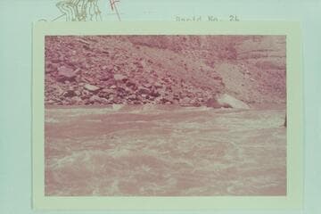 Bill Davis at head of Rapid 22.  [on reverse of photo:  "Rapid at mile 200.  Lining would be better on left bank.  Picture taken from right bank, looking up river.  Water very fast..Fern Davis took picture from right bank.  Very noisy rapid."