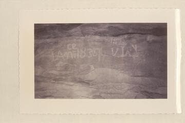 Mile 113 1/4, Glen Canyon.  Inscription across river from mouth of Lake Canyon