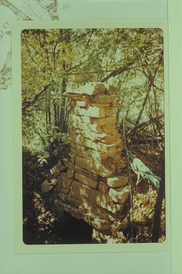 Chimney of Dr. Schock cabin, Mile 110.1, right bank