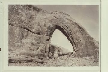 Gothic Arch; width 174 feet, estimated height 190 feet.  End of buttress of Navajo sandstone resting on Kayenta.  Soda Creek branch of Escalante River