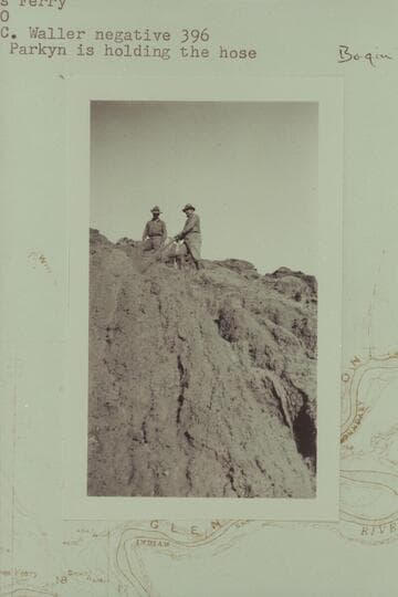 Dr. Parkyn and Daniels washing down the Chinle silts.  Lees Ferry.  Dr. Parkyn is holding the hose