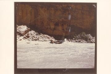 Georgie White's pontoon rig in Dark Canyon Rapid.  The print is reversed