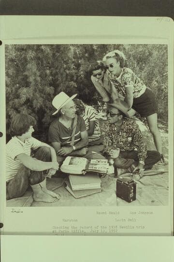 Checking the record of the 1938 Nevills trip at Paria Riffle.  Left to right:  Jodie, Marston, Margaret Marston, Naomi Heald, Lorin Bell and Rosalind Johnson
