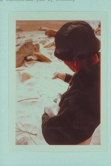 Dock Marston reads the register left by the Hatch party in a bottle near the Kolb inscription at Mile 202.25