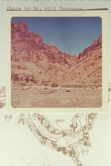 Across the head of Rapid No. 13 into Range Canyon.  Mile 204.8.  The Chenoweth-Hoyt table places the head of the rapid at Mile 205.0