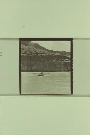 Georgie White and Elgin Pierce leaving Paria Riffle for the Grand Canyon traverse with inflated neoprene boat