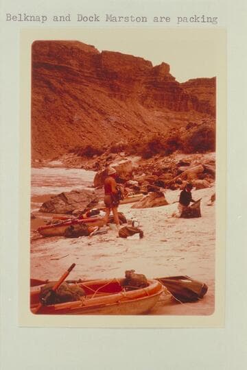 Up river at camp at head of Rapid No. 13.  The knob on the skyline is below the mouth of the side canyon at Mile 205.7.  Bill Belknap and Dock Marston are packing