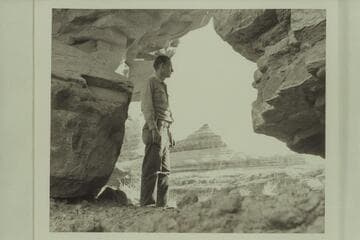 Kent Frost looks thru a breakthru arch in a meander of Salt Creek Canyon