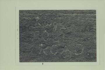 Inscription, "Kings Toll Road" on boulder near road at about Mile 85. Colorado River above Moab